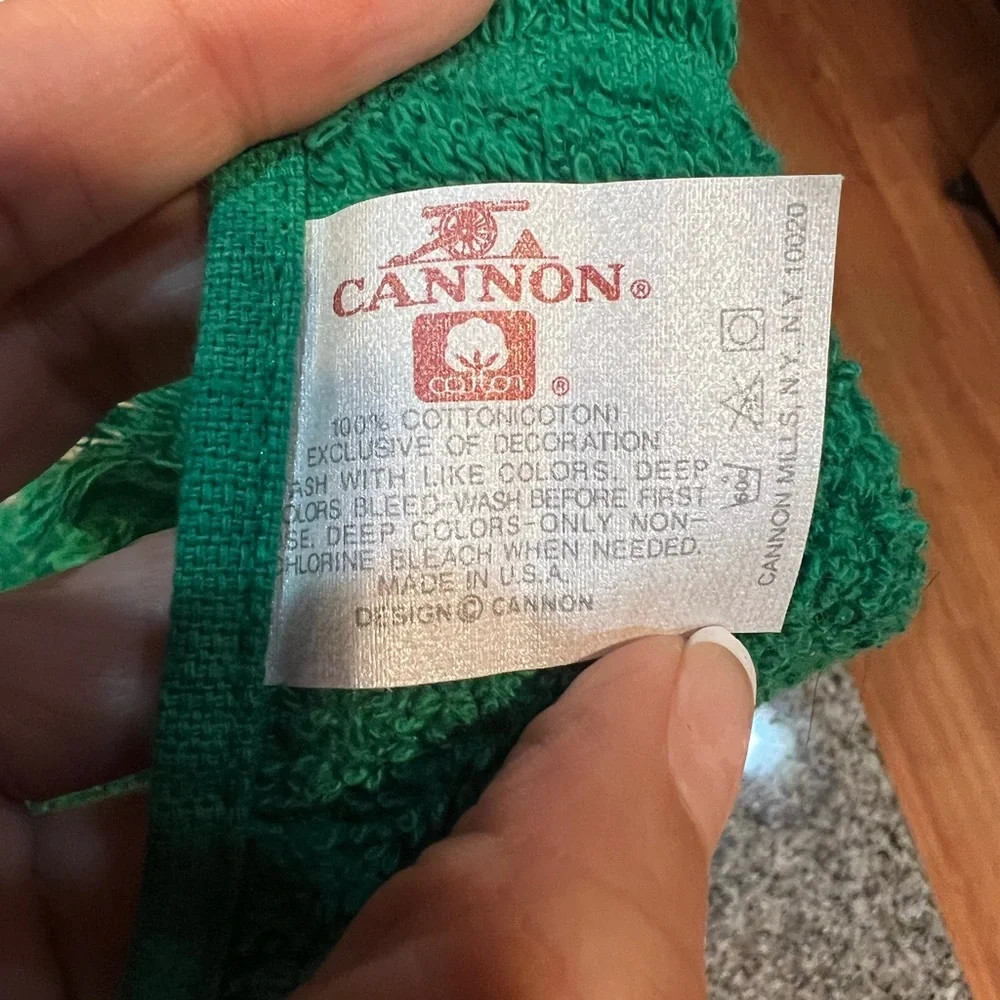 Green vintage towel with white lace and red bow detail